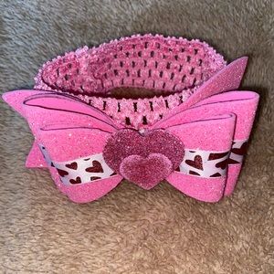 Pink hearted headband.